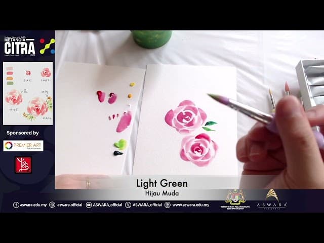 Hands cutting intricate paper design on a wooden table with paint supplies nearby