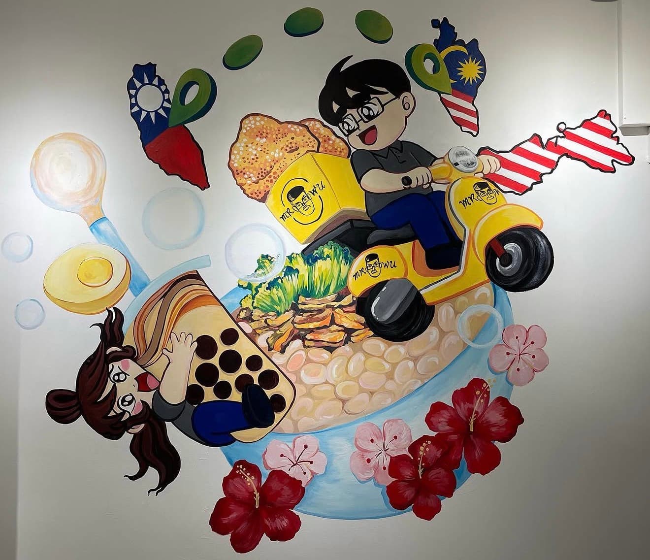 Colorful cartoon mural featuring bubble tea, a scooter, food, and maps of Taiwan and Malaysia.